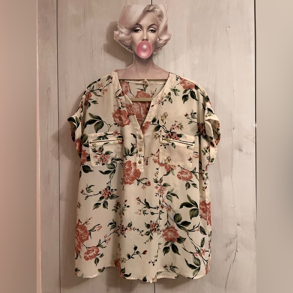 Cream top with dusty rose flower